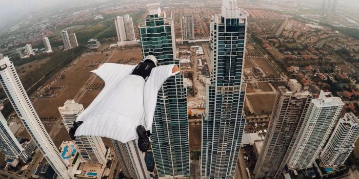 1244x700 Wingsuit Panama City Skyline wallpaper | 1920x1080 | 893171