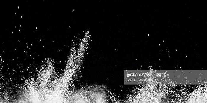 1024x768 Explosion Particles Of White Powder On A Black Background High-Res