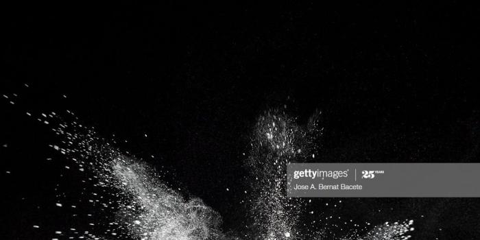 1024x768 Explosion Particles Of White Powder On A Black Background High-Res