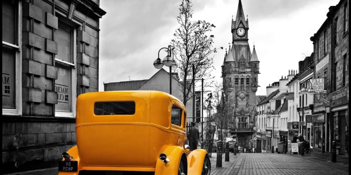2560x1600 Vintage Yellow Car In A Gray City Wallpapers HD / Desktop and