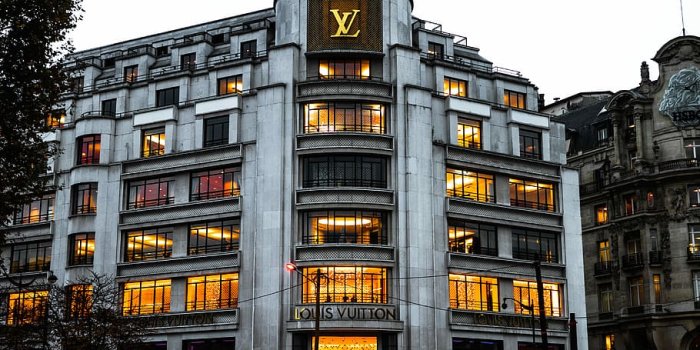 910x1365 HD wallpaper: photo of Louis Vuitton building, white LV concrete