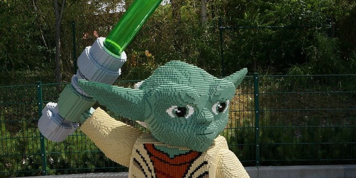 910x1369 HD wallpaper: Yoda holding lightsaber statue, Lego, Legoland, Star