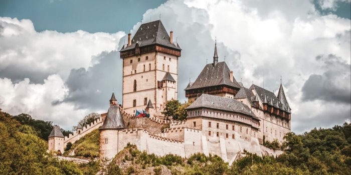 1366x768 Download wallpaper 1366x768 castle, cliff, hill, ancient tablet