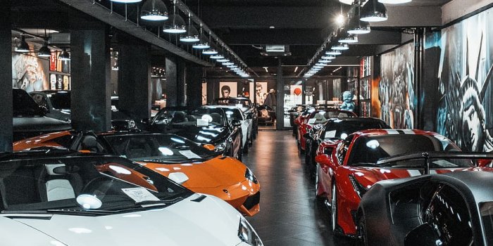 910x1365 HD wallpaper: different luxury cars parking inside building, mode