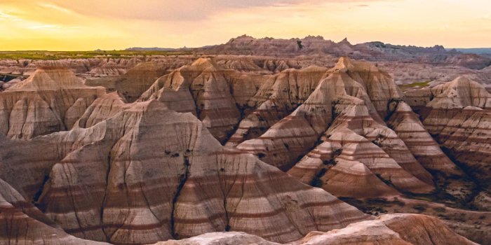 1242x2688 A morning storm in the Badlands being chased away iPhone X