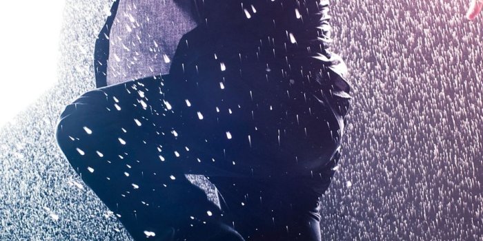 938x1668 Download wallpaper 938x1668 man, jump, rain, light iphone 8/7/6s/6