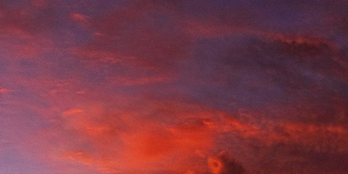 1125x2436 ocean under orange colored clouds iPhone X Wallpapers Free Download