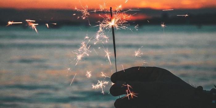 910x1258 HD wallpaper: Silhouette of Person Holding Fireworks, beach, dawn