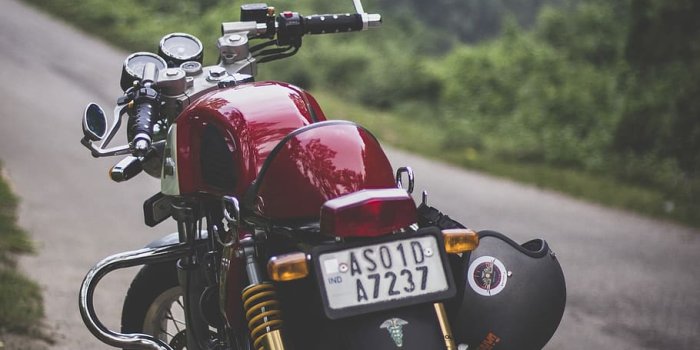 910x1365 HD wallpaper: Red Motorcycle Parked, guwahati, motorbike, triumph