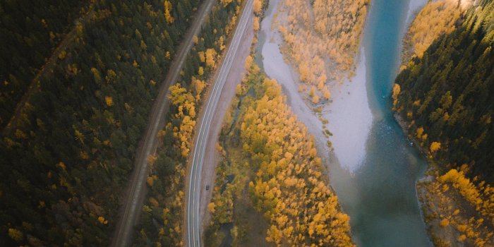 2560x1600 aerial photography of farm road beside river Mac Wallpaper