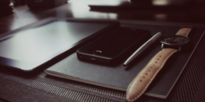 3648x2736 Photo of space gray iPhone, pen, watch, and table aligned and