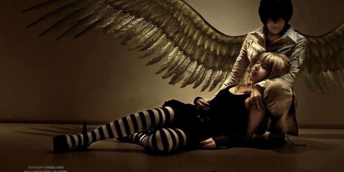 1156x768 Women's black sleeveless dress and pair of white-and-black striped