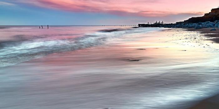 1332x850 Wallpaper sand, sea, wave, beach, clouds, stones, rocks, dawn