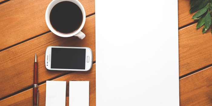 5472x3648 White Samsung Android Smartphone Beside White Ceramic Mug on Brown