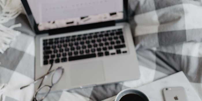 910x1365 HD wallpaper: Everything you need to work from your bed, workspace