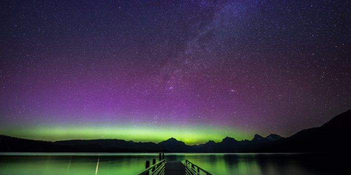 5568x3712 Empty dock surrounded with calm body of water under purple and