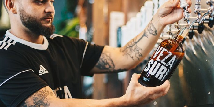 910x1365 HD wallpaper: man pouring liquid on bottle, male, beer, beer craft