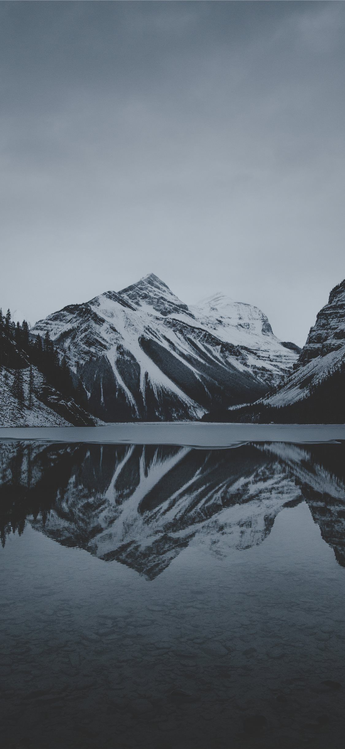 1125x2436 snow mountains and lake undr gray sky iPhone 11 Wallpapers Free