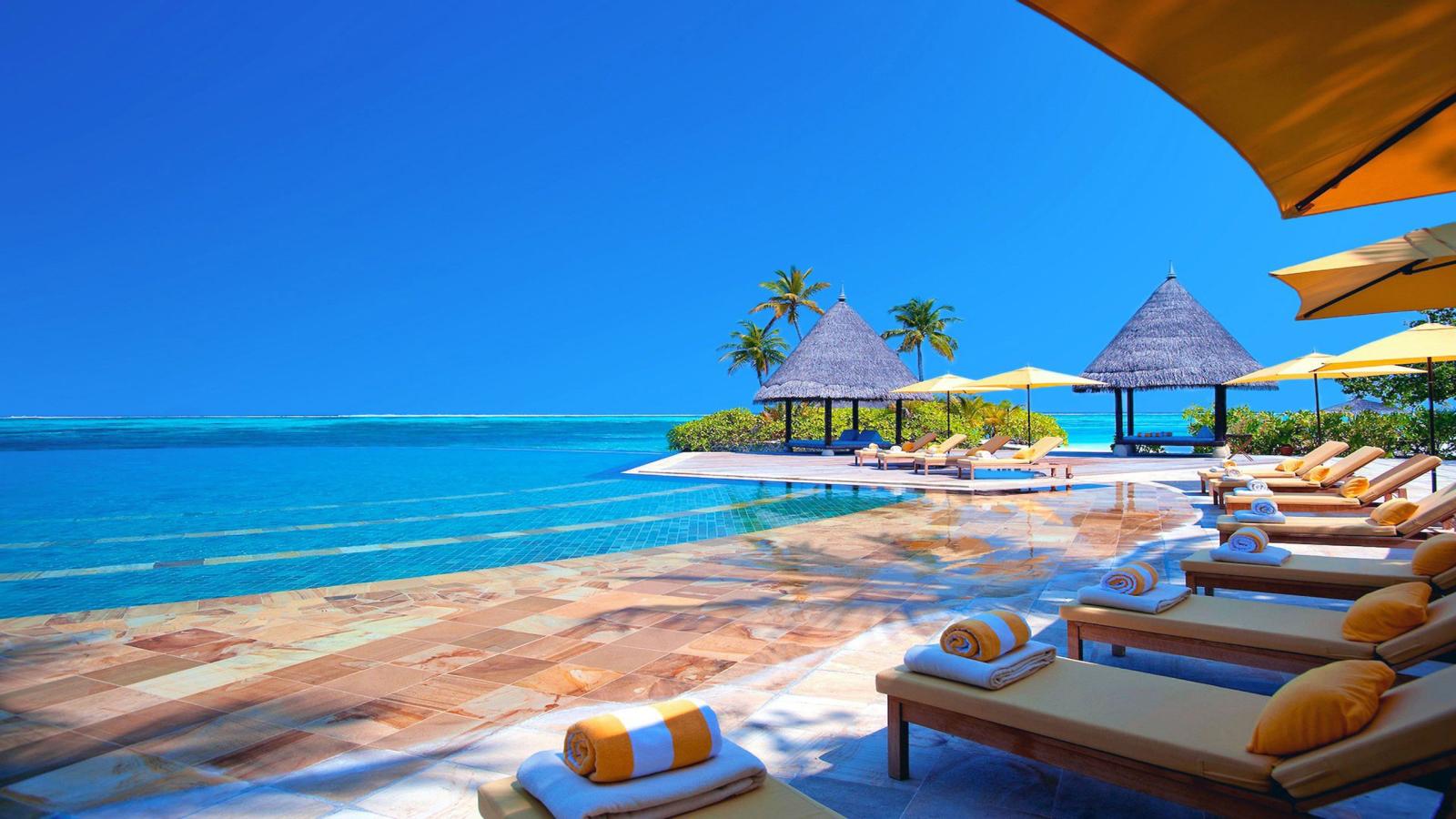 2560x1440 Hotel Terrace Chairs Ocean Maldives Hd Wallpaper 2560x1440
