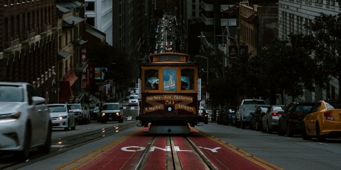 1600x900 Download wallpaper 1600x900 tram, transport, street, city, traffic