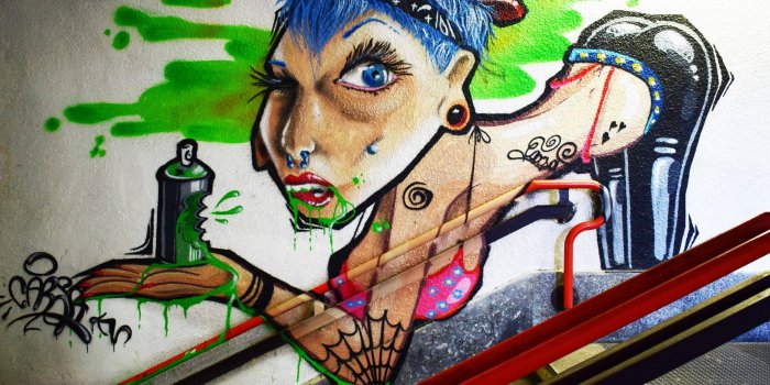 3840x2656 a trashy woman bent over holding a can of green spray paint trashy