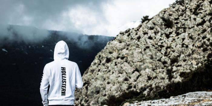 6000x4000 Person Wearing White Hollister Hoodie Standing Near Rock · Free