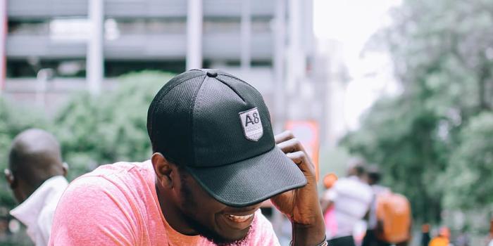 910x1138 HD wallpaper: Photo of Man Using His Cellphone, adult, baseball