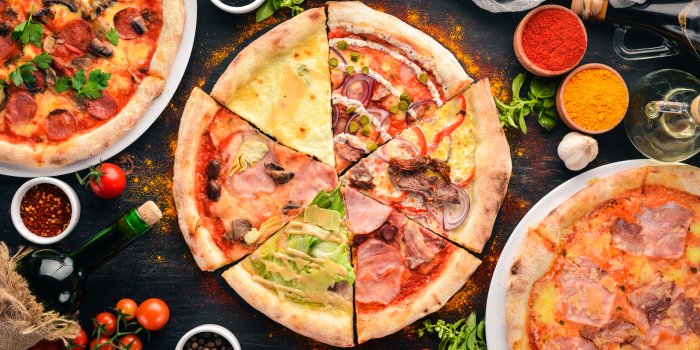 9000x6007 Pizza with various fillings on the table with spices wallpapers and images  - wallpapers, pictures, photos