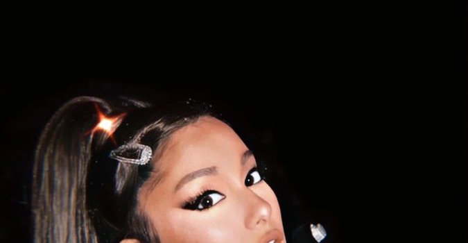 675x1200 Wallpaper Of Ariana Grande