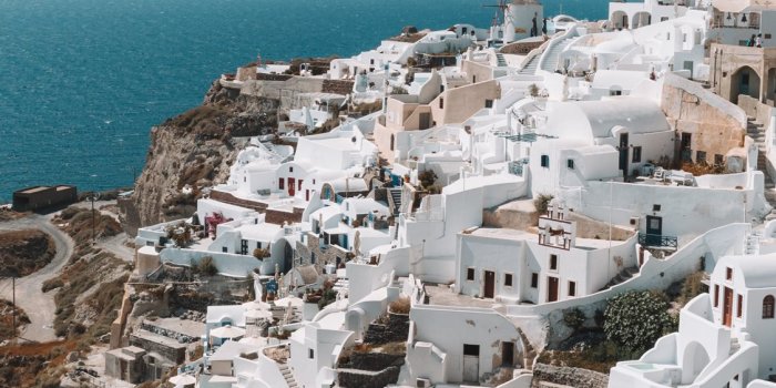 1125x2436 Santorini Greece during daytime iPhone X Wallpapers Free Download