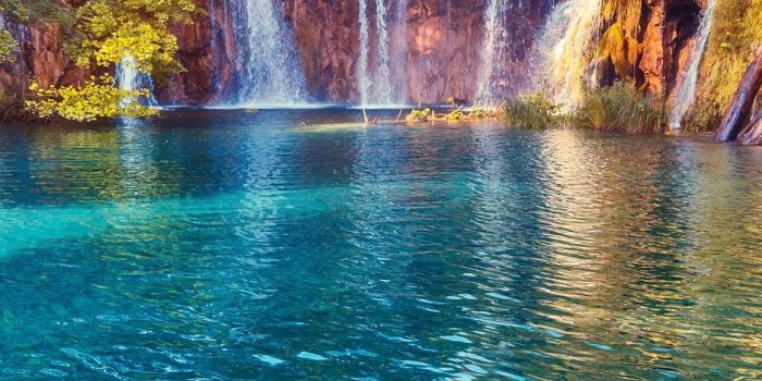 938x1668 Download wallpaper 938x1668 waterfall, precipice, sunlight, summer, bright,  trees iphone 8/7/6s/6 for parallax hd background