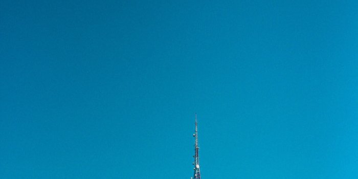 1000x1500 white tower on brown rock mountain under blue sky during daytime photo –  Free Blue Image on Unsplash