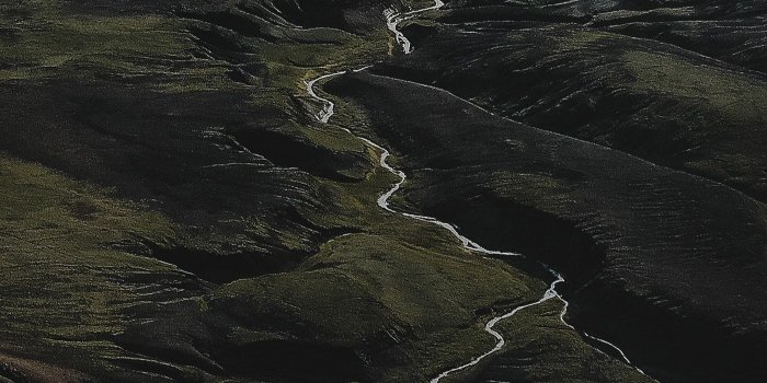 1400x2489 Download premium image of Aerial view of Highland in Iceland mobile phone  wallpaper by Luke Stackpoole about iphone wallpaper dark, photography,  wallpaper, iphone wallpaper dark mountains, and dark aesthetic 1234798