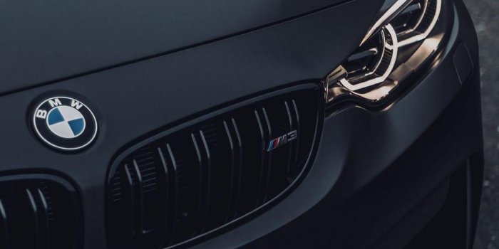 1080x2400 BMW Black Car Wallpaper