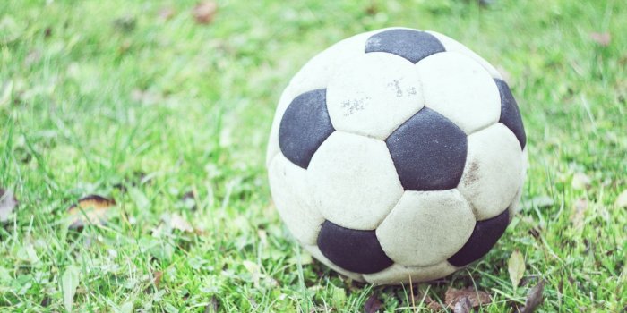 1280x720 Download wallpaper 1280x720 soccer ball, football, grass, blur hd, hdv,  720p hd background