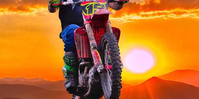 1080x1920 Download Orange Sunset With Dirt Bike Wallpaper | Wallpapers.com