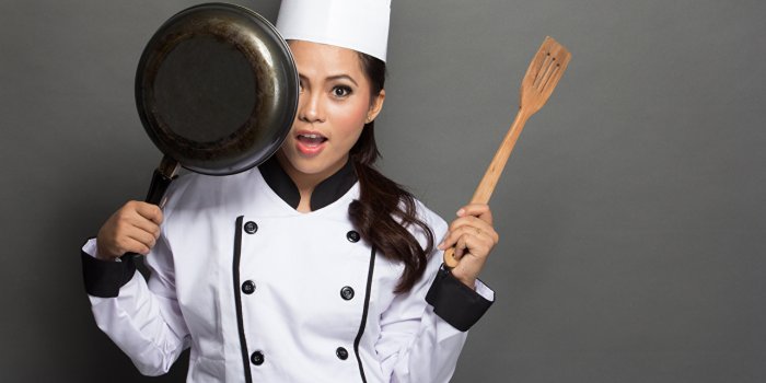 1280x853 Picture young woman Cook Uniform Staring Gray background
