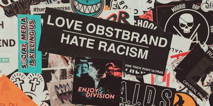 1000x1786 assorted stickers on white wall photo – Free London Image on Unsplash