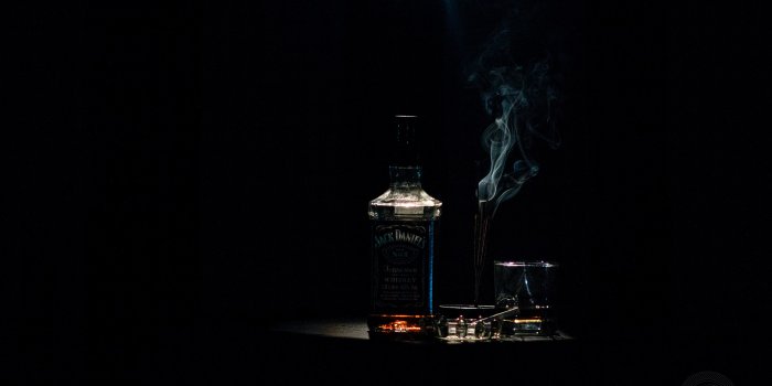 2600x1725 Closeup Photo of Liquor Bottle Against Black Background · Free Stock Photo