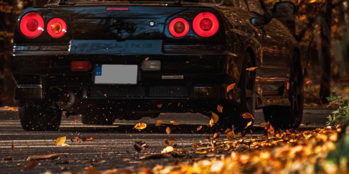 1263x1920 Download Nissan Skyline Gtr R34 At Forest Wallpaper | Wallpapers.com