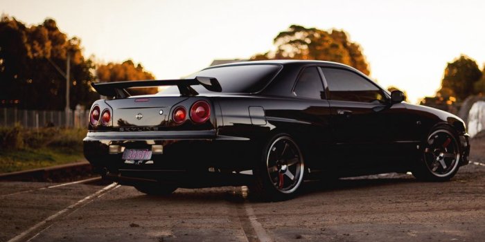 1024x768 Download wallpaper 1024x768 railroad, skyline, r34, nissan, gtr, black,  side view standard 4:3 hd background