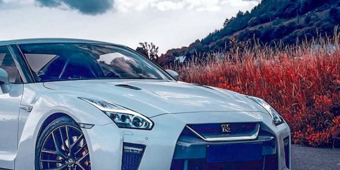 750x1333 Download Nissan R35 Gtr Dark Clouds Wallpaper | Wallpapers.com