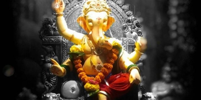 1000x1333 Download Golden Ganesha Figurine Hindu Iphone Wallpaper | Wallpapers.com