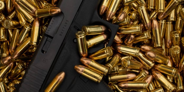 1815x1920 Download Glock On Top Of Bullets Wallpaper | Wallpapers.com