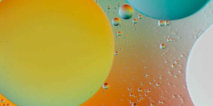 887x1920 Download Ios 15 Floating Spheres Wallpaper | Wallpapers.com