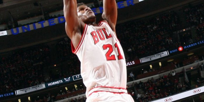 1080x1920 Download Jimmy Butler Mid-Air Dunk Bulls Wallpaper | Wallpapers.com