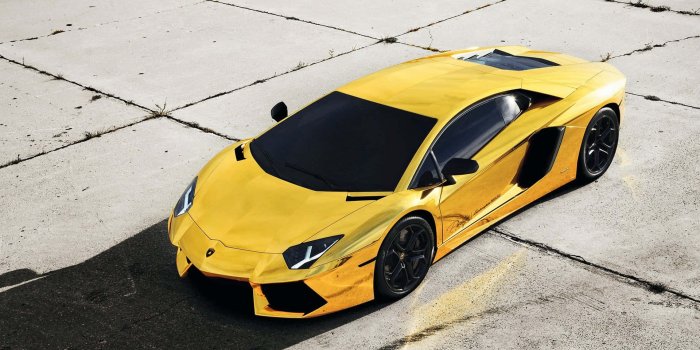 1920x1080 Download Yellow Gold Lamborghini On Display Wallpaper | Wallpapers.com
