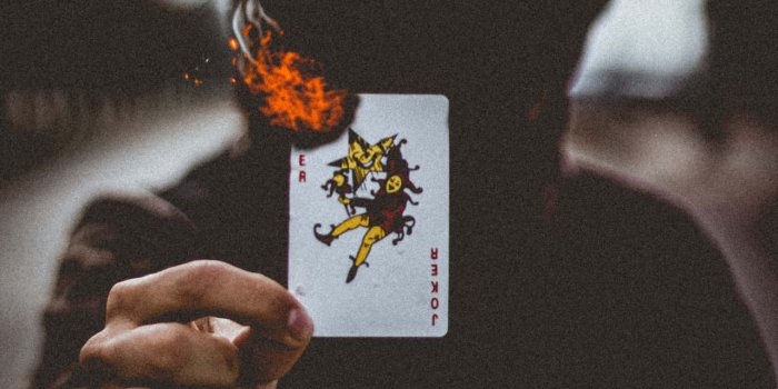1280x1920 Download Cool Joker Card On Fire Wallpaper | Wallpapers.com
