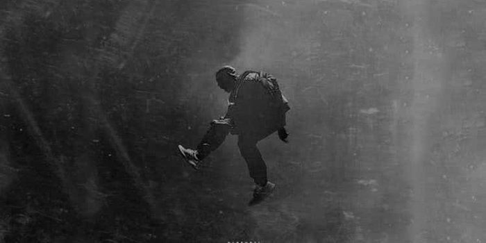 750x1334 Download Kanye West Wears Yeezy 750 Sneakers Wallpaper | Wallpapers.com