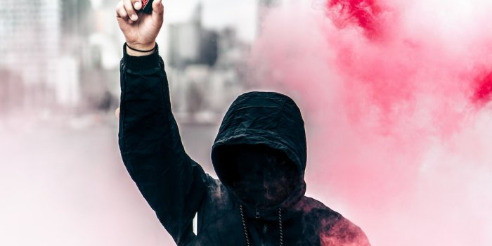 1000x1612 red hoodie holding smoke bomb photo